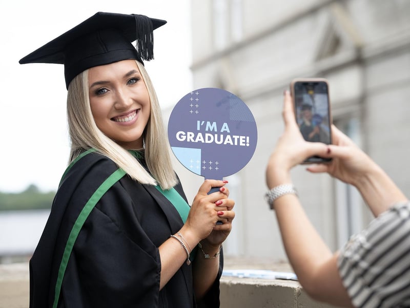 Katie Taylor from Ballyclare celebrates as she graduates with a degree in social work from Ulster University in Derry on Monday July 8.  (Photo: Nigel McDowell / Ulster University)