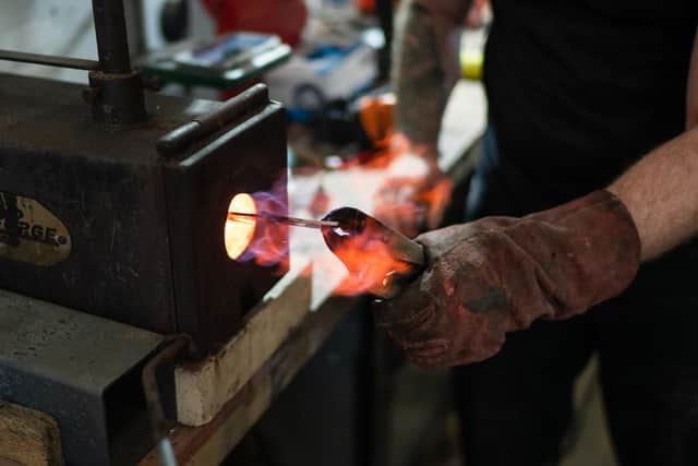 Joe smithing at his premises.