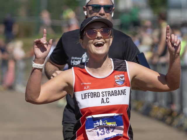A delighted Andrea Porter [Lifford Strabane AC] makes her way over the finish line.