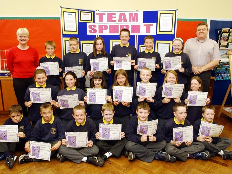 Pupils from Ebrington who took part in a Young Enterprise project with local businesses. Included are Irene Stone, teacher, and Ken Donaghey, DuPont.