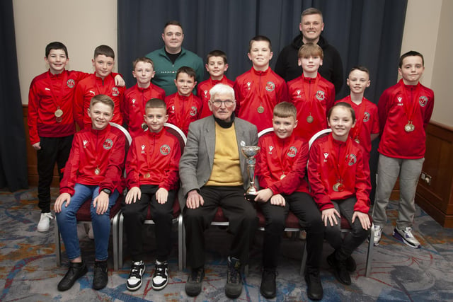 John ‘Jobby’ Crossan pictured with the Newell Academy 2011's team who were Winter Cup winners the Annual Awards in the City Hotel on Friday night last. Included are coaches Gavin Duffy and Darren Quigley.