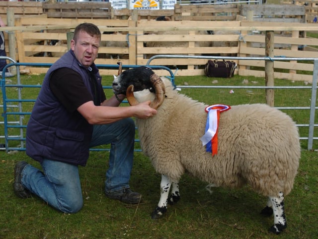 John friel, pictured with his Black faced Mountain yearling Ram, winner fo the overall category at the show sponsored by Bibby's Feeds. (0508A45) : Clonmany Festival, Vintage Show, Agricultural Show and Raft Race in August 2005.