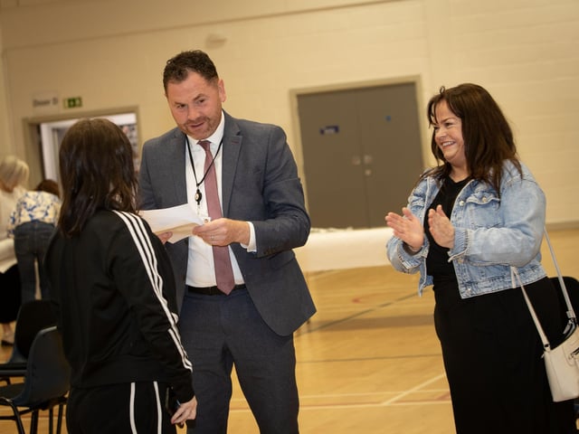 Mr. Conor Lynch, Vice Principal, St. Mary's giving some good news to an A Level student on Thurday morning as a delighted mum looks on. (Photos: JIm McCafferty Photography)