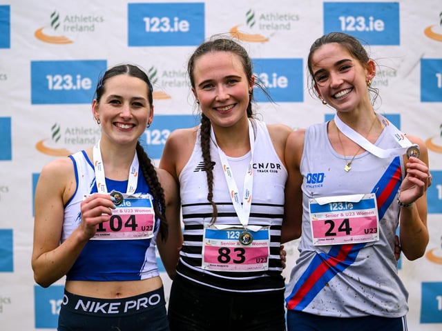 The women's U23 podium, from left, second place Amy Greene of Finn Valley AC, Donegal, race winner Roise Roberts of CNDR Track AC, Antrim, and third place Eimear Maher of Dundrum South Dublin AC, Dublin, during the 123.ie National Cross Country Championships at Templemore Sports Complex in Derry. Photo by Ramsey Cardy/Sportsfile