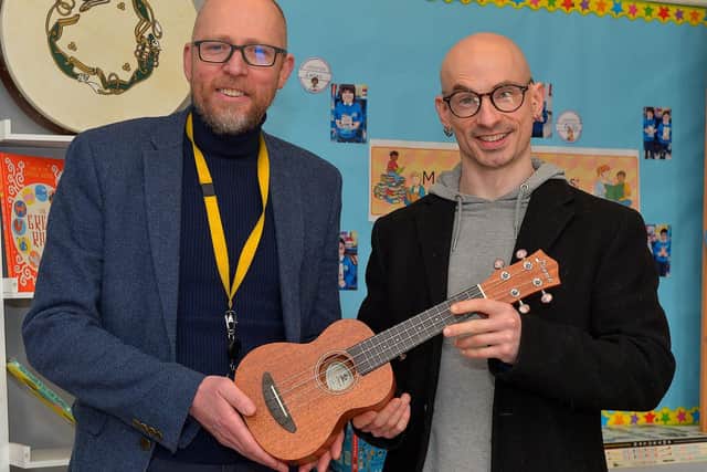 Principal Gareth Blackery, and Eamonn McCarron, from Project Sparks, pictured with one of the musical instruments donated to St Paul’s Primary School, Slievemore on Tuesday last. Photo: George Sweeney. DER2310GS – 012
