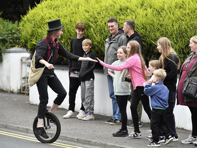 Muff Feile opening parade makes its way through the village on Friday evening. Photo: George Sweeney