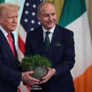 WASHINGTON, DC - MARCH 12:  Irish Taoiseach Micheál Martin presents U.S President Donald Trump with a bowl of clover during a St. Patrick’s Day event in the East Room of the White House on March 12, 2025 in Washington, DC. Martin traveled to the United States for the Irish leader's annual St. Patrick's Day visit where he attended a luncheon with Congressional leaders and a meeting in the Oval Office with Trump.  (Photo by Kayla Bartkowski/Getty Images)
