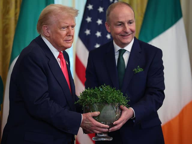 WASHINGTON, DC - MARCH 12:  Irish Taoiseach Micheál Martin presents U.S President Donald Trump with a bowl of clover during a St. Patrick’s Day event in the East Room of the White House on March 12, 2025 in Washington, DC. Martin traveled to the United States for the Irish leader's annual St. Patrick's Day visit where he attended a luncheon with Congressional leaders and a meeting in the Oval Office with Trump.  (Photo by Kayla Bartkowski/Getty Images)