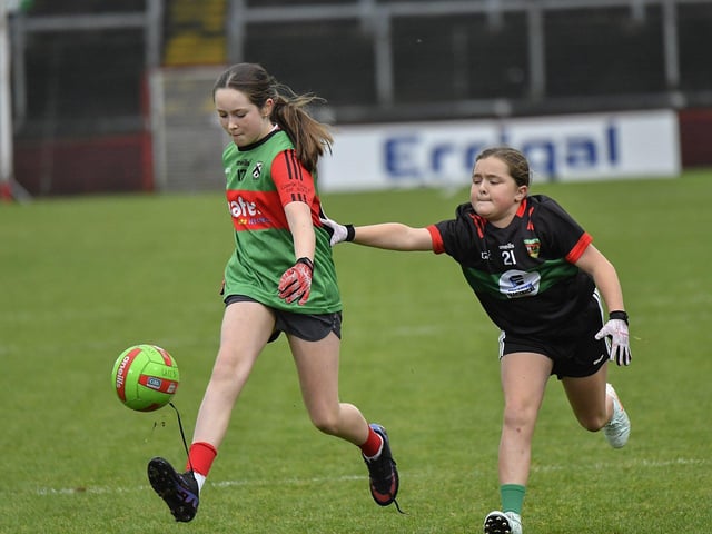 Young footballers from Doire Trasna and Slaughtmanus Under 12 teams play at half-time at the Derry Junior Football Championship Final held in Celtic Park on Sunday afternoon. Photo: George Sweeney
