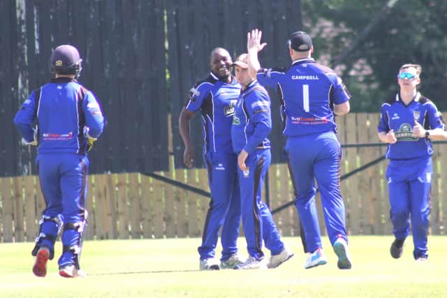 Coleraine celebrate a wicket against Donemana. (Photo: Lawrence Moore)