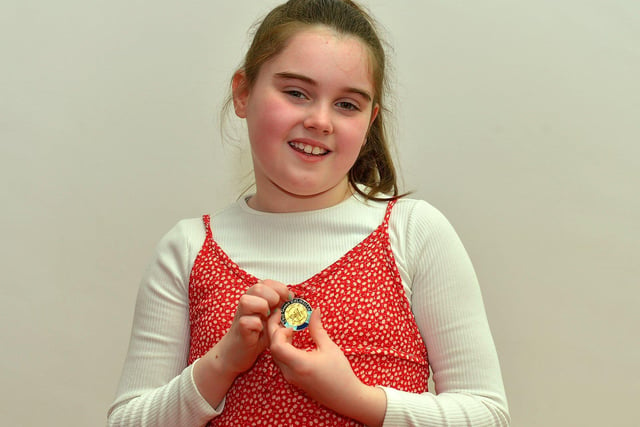 Clodagh Robson, Oakgrove PS, was awarded first place in P5 Girls Verse at the Feis Dhoire Cholmcille on Thursday at the Millennium Forum. Photo: George Sweeney.  DER2315GS – 198