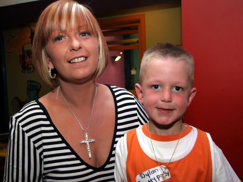 Godmother Sally joins in the celebrations with birthday boy Dylan 0566JML : Parties and celebrations June 2006: Dylan McDaid.