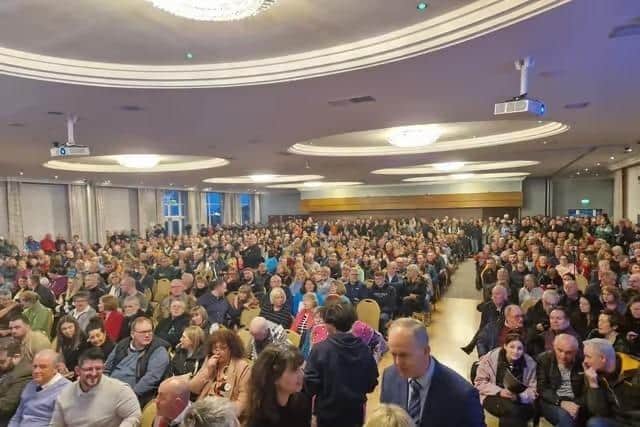 People impacted by defective blocks in attendance at a meeting in 2024.