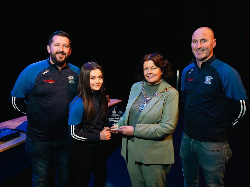 Derry City & Strabane District Council Mayor Patricia Logue with coaches Chris McDaid, John Roulston, and captain Kayla Doherty, whose under-11 side won the League and Summer Cup.