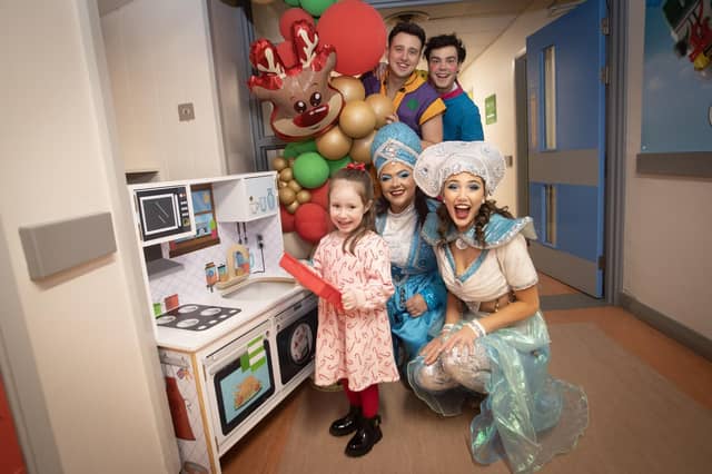Characters from 'Aladdin' the 2024 Christmas Pantomime at the Millennium Forum pictured on a visit to the Children's Ward at Altnagelvin Hospital on Thursday afternoon. They are pictured with 4 years old Mia Grumley.
