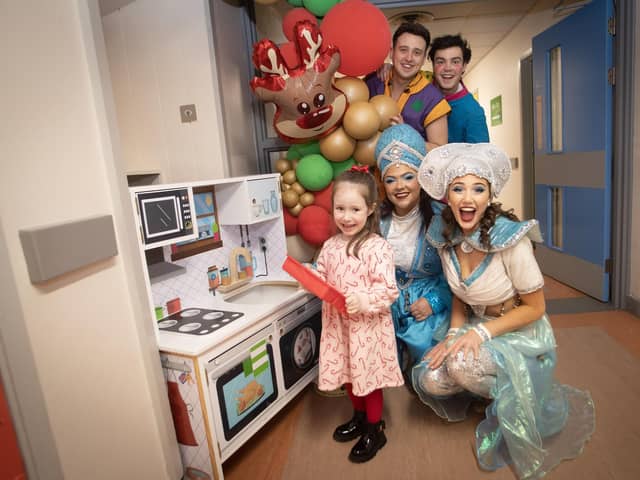 Characters from 'Aladdin' the 2024 Christmas Pantomime at the Millennium Forum pictured on a visit to the Children's Ward at Altnagelvin Hospital on Thursday afternoon. They are pictured with 4 years old Mia Grumley.
