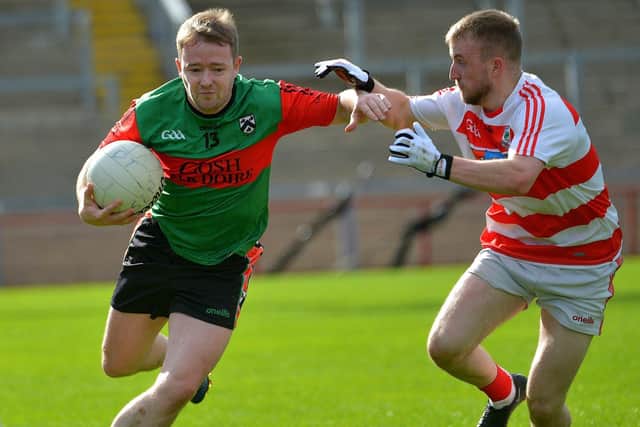 Doire Trasna’s holds of a challenge from Ballerin’s  Sean Ferris during the JFC Semi Final in Celtic Park on Sunday afternoon last. Photo: George Sweeney.  DER2240GS – 010