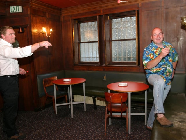 Throwing darts in Tinney's in June 2004.