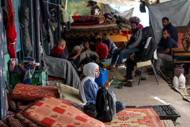 Displaced Palestinians take shelter in a UN school in Bureij in the central Gaza Strip, on November 21, 2023, amid the ongoing battles between Israel and the Palestinian militant group Hamas. (Photo by MOHAMMED ABED / AFP) (Photo by MOHAMMED ABED/AFP via Getty Images)