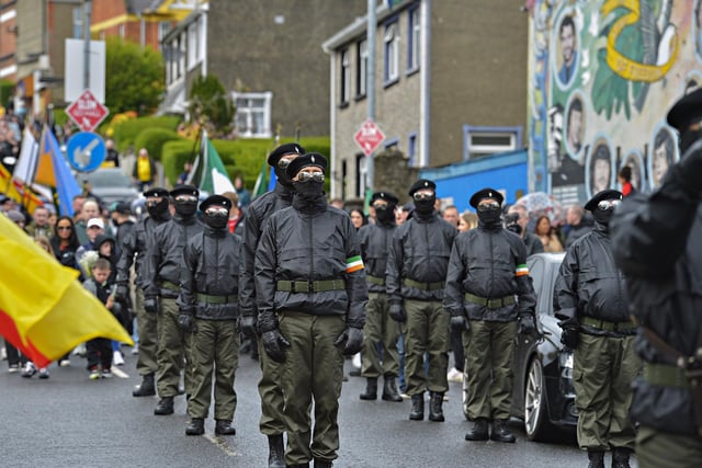 The Saoradh National Easter Commemoration march pauses at the Hunger Strike mural on Westland Street. Photo: George Sweeney