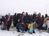 Refugees fleeing conflict make their way to the Krakovets border crossing with Poland on March 09, 2022 in Krakovets, Ukraine. More than a million people have fled Ukraine following Russia's large-scale assault on the country, with hundreds of thousands of Ukrainians passing through Lviv on their way to Poland. (Photo by Dan Kitwood/Getty Images)
