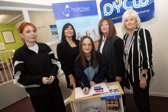 SKY PROJECT SIGN-UP!. . . . .Tyra Boyle and Cara Kelly signing up for the Sky Project at last week's launch in the Derry Youth and Community Workshop. Included in the photo, from left are Rosemary McKinney, Youth Support Mentor, SKY Project, Lisa Boggs, National Lottery Funding Officer, and Eleanor Conaghan, Youth Support Mentor, SKY Project. (Photos: Jim McCafferty Photography)