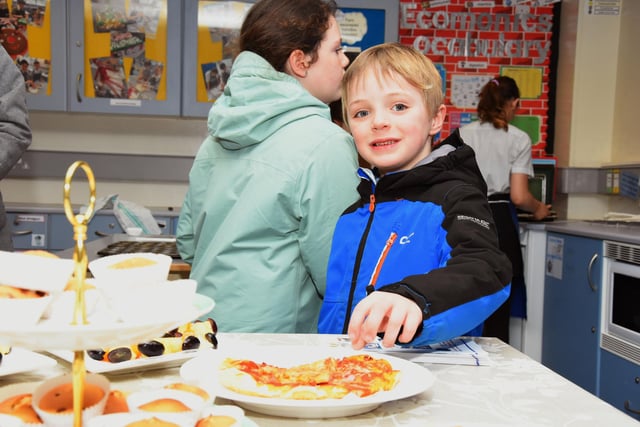 This young chap sneaking some pizza during Oakgrove College Open Day.