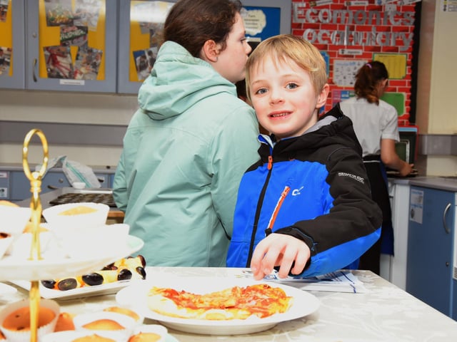 This young chap sneaking some pizza during Oakgrove College Open Day.