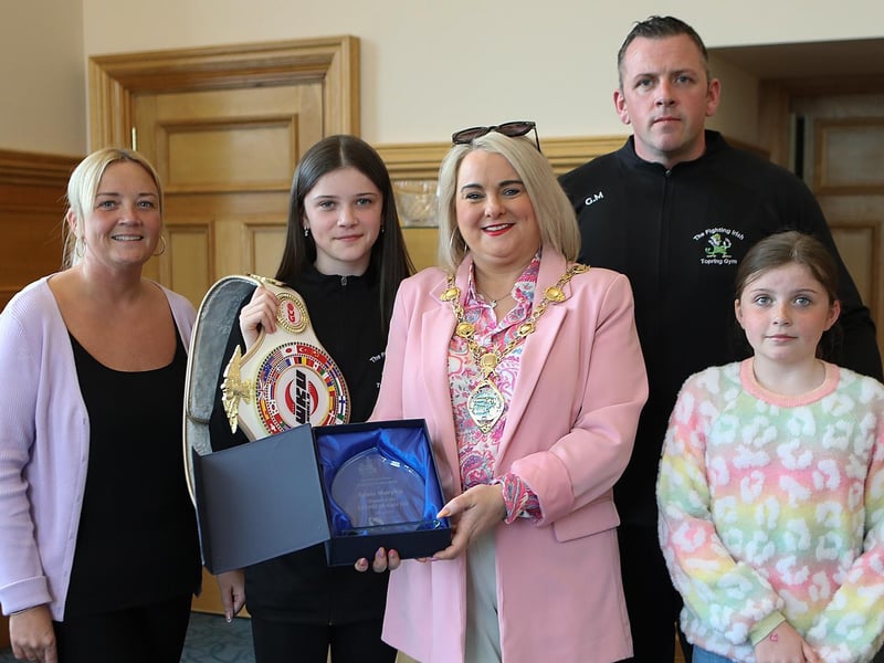 Mayor Sandra Duffy makes a presentation to 13 years old Annie Murphy, winner of the WKU Pro-Am World Kick-boxing title at a civic reception held in the Mayor’s Parlour. Included are mum Michelle, dad Gareth and wee sister Charlene. (Photo - Tom Heaney, nwpresspics)