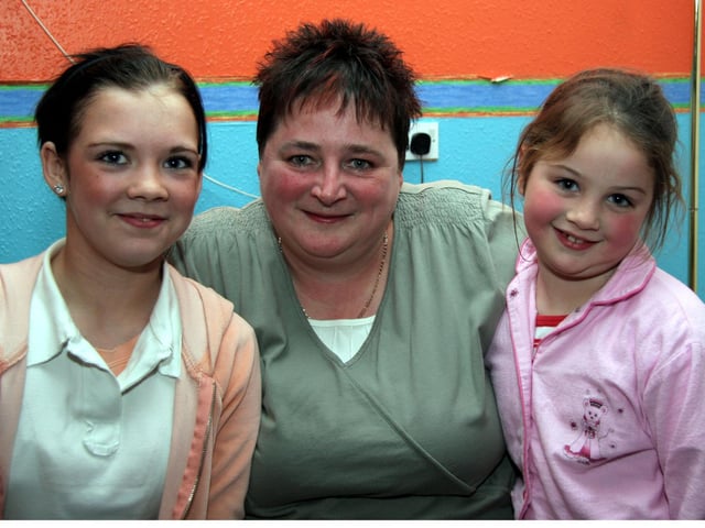 Sharon smiles for the camera with Goddaughters, Amy and Dearbhla 0097JML : Parties and celebrations March 2006: Sharon McClelland.