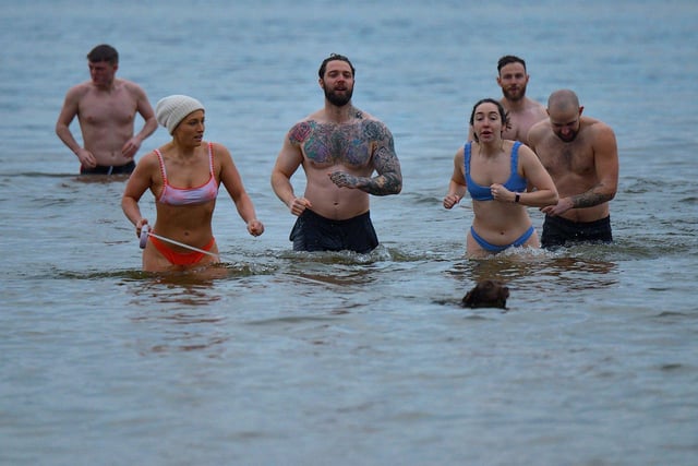 Swimmers take part in the annual ARC Fitness New Year's Day Charity Swim at Lisfannon beach.  Photo: George Sweeney. DER2301GS  05