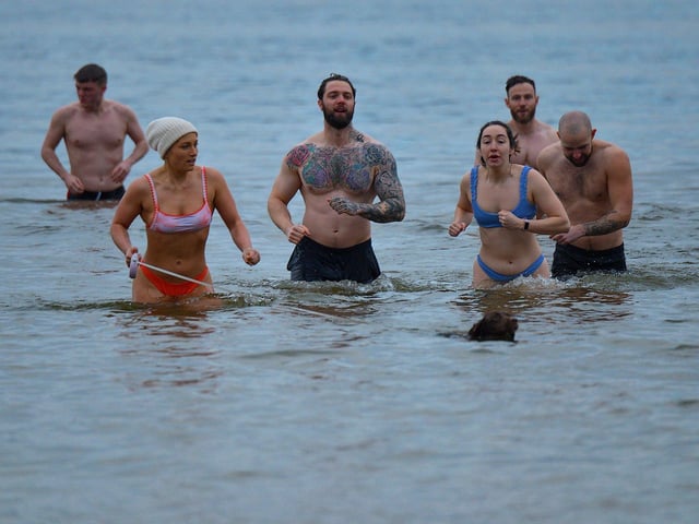 Swimmers take part in the annual ARC Fitness New Year's Day Charity Swim at Lisfannon beach.  Photo: George Sweeney. DER2301GS  05