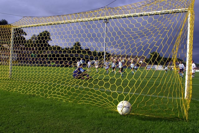 Tommy McCallion's penalty nestles in the back of the Real Madrid net.