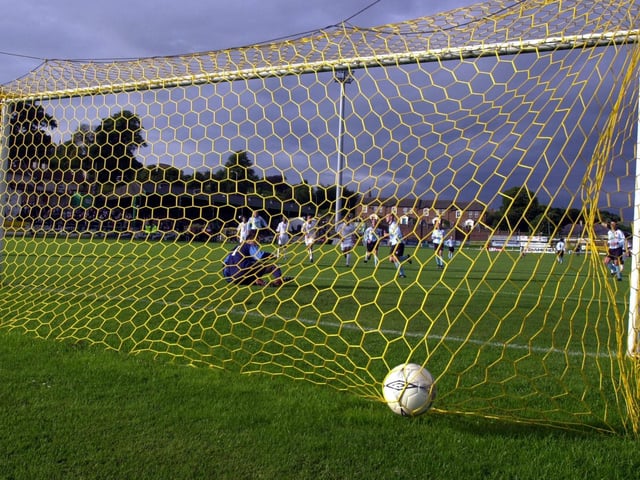 Tommy McCallion's penalty nestles in the back of the Real Madrid net.