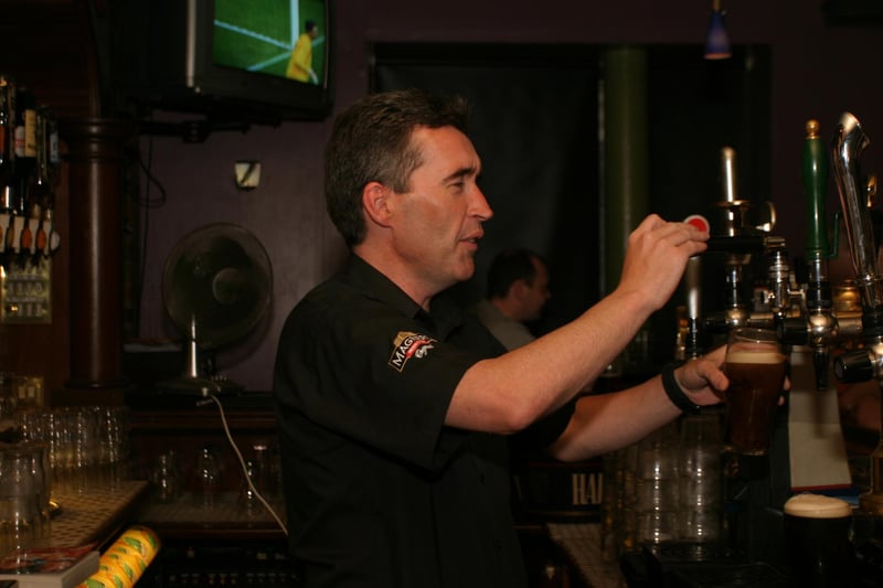 Pulling the pints and serving customers in the River Inn.