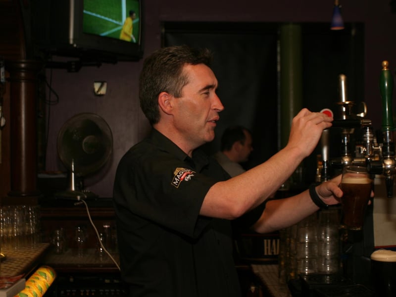 Pulling the pints and serving customers in the River Inn.