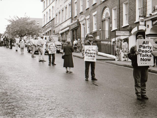 Sinn Féin's Martin McGuinness, Mary Nelis and other party members leading protests calling for all party peace talks.