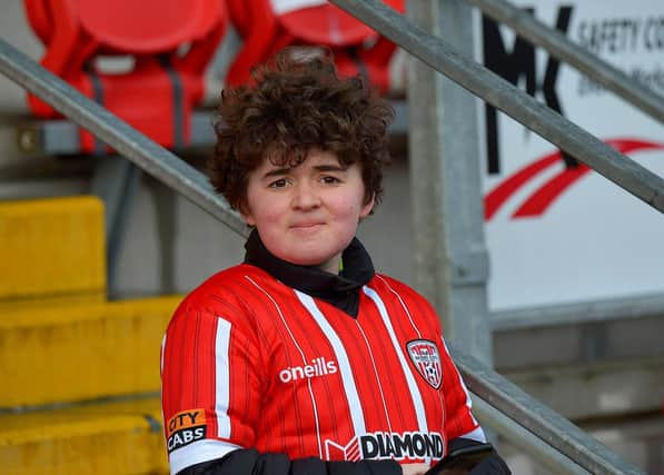 This young Derry City fan spots our cameraman at the game against Finn Harps. Photo: George Sweeney. DER2305GS – 03