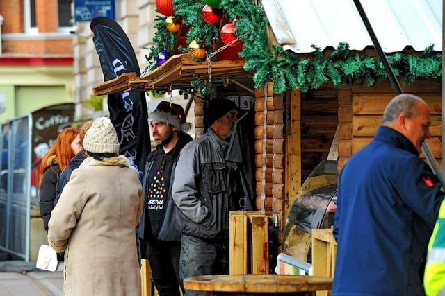 People visiting the Christmas Market in Guildhall Square on Friday afternoon. Photo: George Sweeney. DER2250GS – 69
