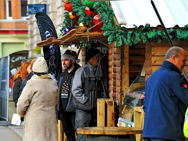 People visiting the Christmas Market in Guildhall Square on Friday afternoon. Photo: George Sweeney. DER2250GS – 69