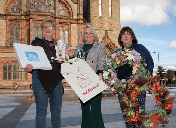 Mayor of Derry City and Strabane District Council, Councillor Sandra Duffy, with Maureen McGhee, Jewellery and Art works and on right Monica Fee, Five Oaks Floral Design, at the launch of the 2022 Guildhall Craft Fair. (Photo - Tom Heaney, nwpresspics)