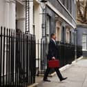 LONDON, ENGLAND - MARCH 15: UK Chancellor Jeremy Hunt leaves Downing Street with the despatch box to present his spring budget to parliament on March 15, 2023 in London, England. Highlights of the 2023 budget are an increase in the tax-free allowance for pensions which the Chancellor hopes will stem the number of people taking retirement, a package of help for swimming pools affected by the increase in energy bills and changes to childcare support for parents on universal credit. (Photo by Dan Kitwood/Getty Images)