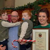 Lisa McGee, creator of Derry Girls, who was conferred with the Freedom of Derry City and Strabane by councillors yesterday evening pictured with her husband Tobias Beer and children in the Guildhall. Photo: George Sweeney. DER2249GS – 04
