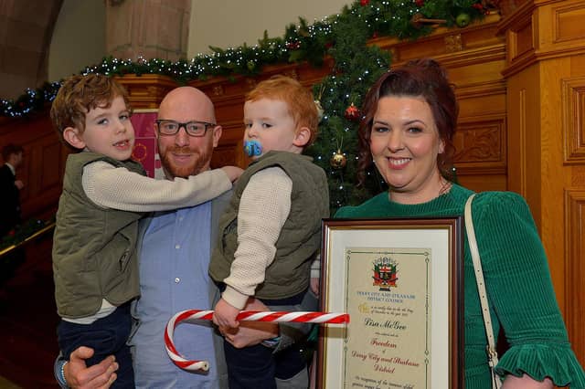 Lisa McGee, creator of Derry Girls, who was conferred with the Freedom of Derry City and Strabane by councillors yesterday evening pictured with her husband Tobias Beer and children in the Guildhall. Photo: George Sweeney. DER2249GS – 04