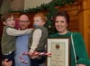 Lisa McGee, creator of Derry Girls, who was conferred with the Freedom of Derry City and Strabane by councillors yesterday evening pictured with her husband Tobias Beer and children in the Guildhall. Photo: George Sweeney. DER2249GS – 04
