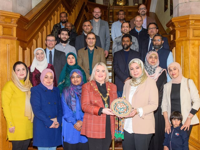 The Mayor, Councillor Sandra Duffy hosted a reception for members of the North West Islamic Association in the Guildhall where she was presented with a gift by Dina Gomaa . Picture Martin McKeown. 10.11.22