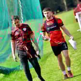 A WORD IN YOUR EAR . . . Adam O'Reilly walking alongside manager Tiernan Lynch at training this week. Photograph by Kevin Morrison.