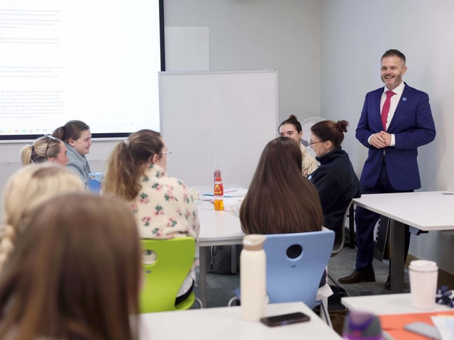 Health Minister Robbie Butler during a visit to Magee College.