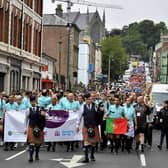 The Foyle Cup teams parade down Great James Street towards the Guildhall Square. Photo: George Sweeney