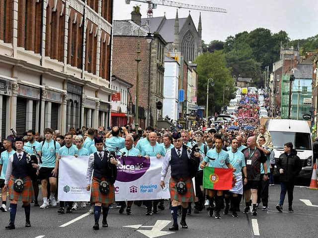 The Foyle Cup teams parade down Great James Street towards the Guildhall Square. Photo: George Sweeney